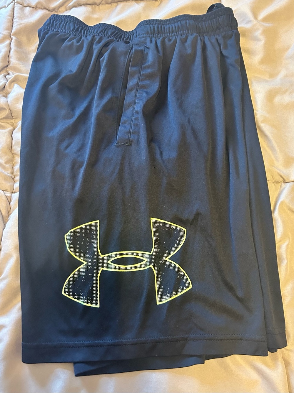 Men size small. Under Armour Black Shorts with Neon Yellow Logo